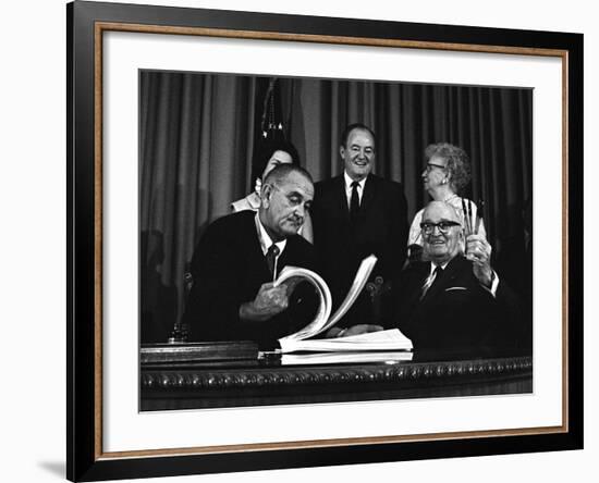 Lyndon Johnson Signing the Medicare Bill with Former President Truman, July 7,1965-null-Framed Photo