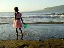 A Girl Walks on the Beach in Jacmel, Haiti, in This February 5, 2001-Lynne Sladky-Framed Premier Image Canvas