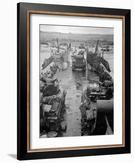 M4 Sherman Tanks with Exhaust Stacks Driving Off a Landing Craft Towards a Beach-null-Framed Photographic Print