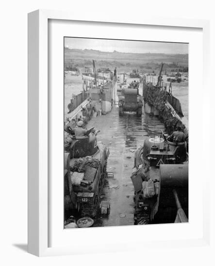 M4 Sherman Tanks with Exhaust Stacks Driving Off a Landing Craft Towards a Beach-null-Framed Photographic Print