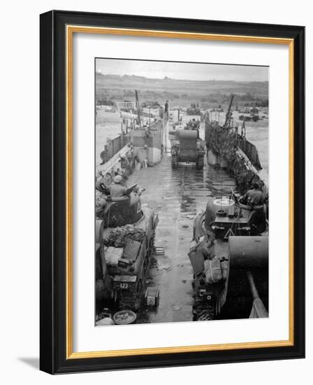 M4 Sherman Tanks with Exhaust Stacks Driving Off a Landing Craft Towards a Beach-null-Framed Photographic Print