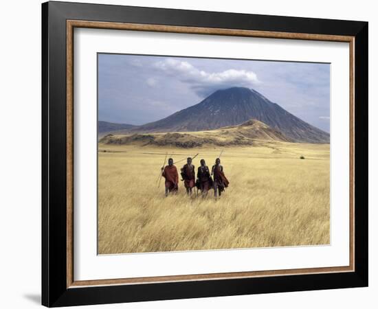 Maasai Warriors Stride across Golden Grass Plains at Foot of Ol Doinyo Lengai, 'Mountain of God'-Nigel Pavitt-Framed Photographic Print