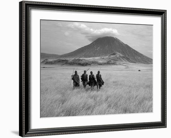 Maasai Warriors Stride across Golden Grass Plains at Foot of Ol Doinyo Lengai, 'Mountain of God'-Nigel Pavitt-Framed Photographic Print