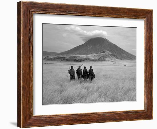 Maasai Warriors Stride across Golden Grass Plains at Foot of Ol Doinyo Lengai, 'Mountain of God'-Nigel Pavitt-Framed Photographic Print