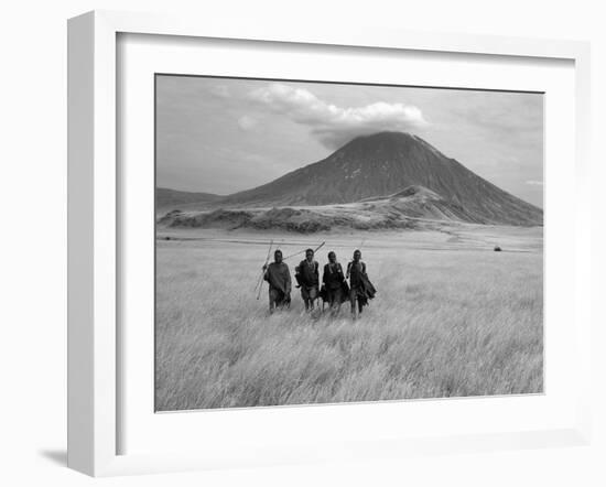 Maasai Warriors Stride across Golden Grass Plains at Foot of Ol Doinyo Lengai, 'Mountain of God'-Nigel Pavitt-Framed Photographic Print