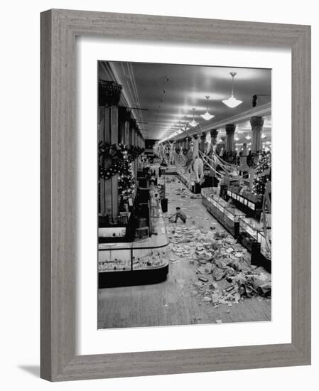Macy's Department Store Employee Cleaning Up Piles of Debris after the Christmas Shopping Rush-Nina Leen-Framed Photographic Print