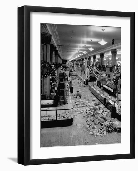 Macy's Department Store Employee Cleaning Up Piles of Debris after the Christmas Shopping Rush-Nina Leen-Framed Photographic Print