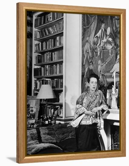 Madam Elsa Schiaparelli Enjoying Her Study Which is Filled with Treasures, Paintings, and Books-Hans Wild-Framed Premier Image Canvas