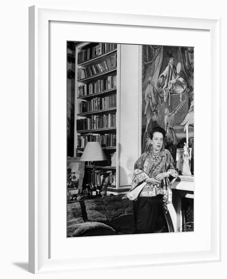 Madam Elsa Schiaparelli Enjoying Her Study Which is Filled with Treasures, Paintings, and Books-Hans Wild-Framed Premium Photographic Print