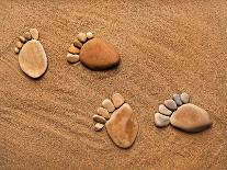 Trace Feet Steps Made Of A Pebble Stone On The Sea Sand Backdrop-Madlen-Photographic Print