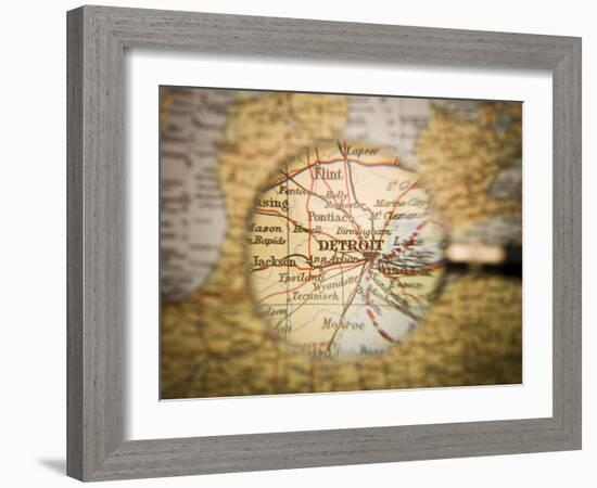 Magnifying Glass In Front Of A Detroit Map-gemenacom-Framed Art Print