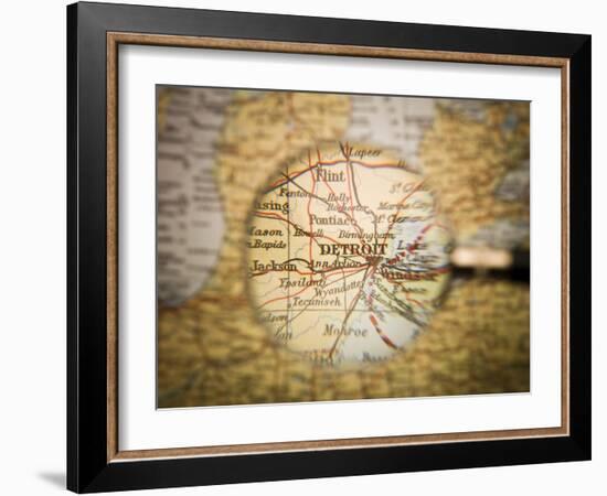 Magnifying Glass In Front Of A Detroit Map-gemenacom-Framed Art Print