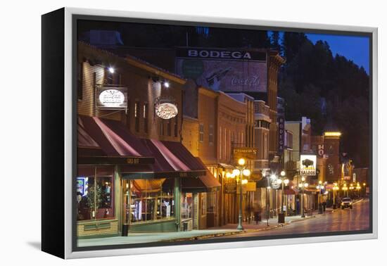 Main Street at Dusk, Deadwood, South Dakota, USA-Walter Bibikow-Framed Premier Image Canvas