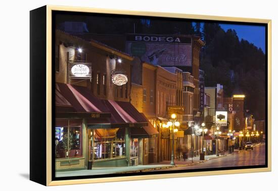 Main Street at Dusk, Deadwood, South Dakota, USA-Walter Bibikow-Framed Premier Image Canvas