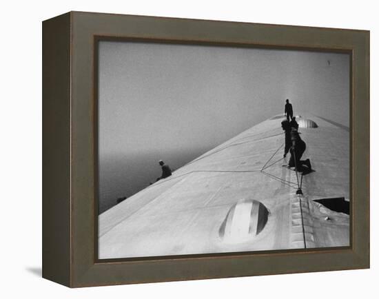 Maintenance Crewmen on Top of Graf Zeppelin repair damage caused Atlantic Ocean Storm during flight-Alfred Eisenstaedt-Framed Premier Image Canvas