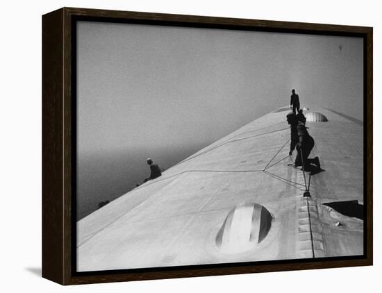 Maintenance Crewmen on Top of Graf Zeppelin repair damage caused Atlantic Ocean Storm during flight-Alfred Eisenstaedt-Framed Premier Image Canvas