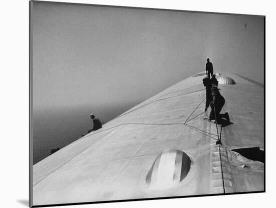 Maintenance Crewmen on Top of Graf Zeppelin repair damage caused Atlantic Ocean Storm during flight-Alfred Eisenstaedt-Mounted Photographic Print