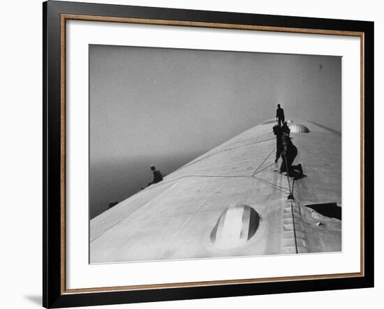 Maintenance Crewmen on Top of Graf Zeppelin repair damage caused Atlantic Ocean Storm during flight-Alfred Eisenstaedt-Framed Photographic Print