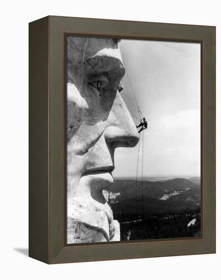 Maintenance Worker on the Nose of Mount Rushmore's Abraham Lincoln, South Dakota, 1960s-null-Framed Stretched Canvas