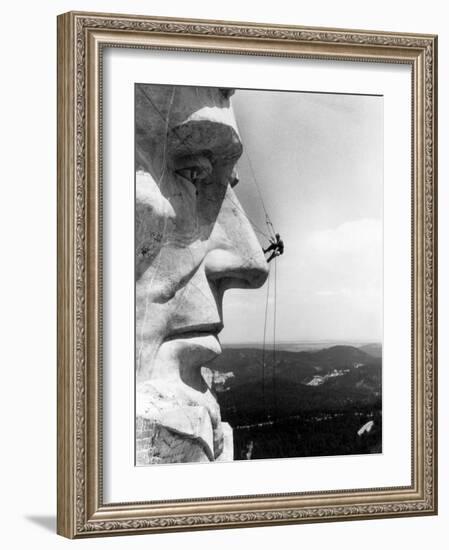 Maintenance Worker on the Nose of Mount Rushmore's Abraham Lincoln, South Dakota, 1960s-null-Framed Photo