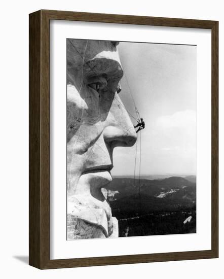 Maintenance Worker on the Nose of Mount Rushmore's Abraham Lincoln, South Dakota, 1960s-null-Framed Photo