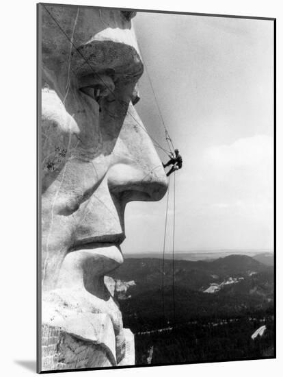 Maintenance Worker on the Nose of Mount Rushmore's Abraham Lincoln, South Dakota, 1960s-null-Mounted Photo