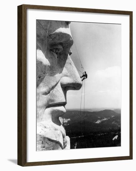 Maintenance Worker on the Nose of Mount Rushmore's Abraham Lincoln, South Dakota, 1960s-null-Framed Photo