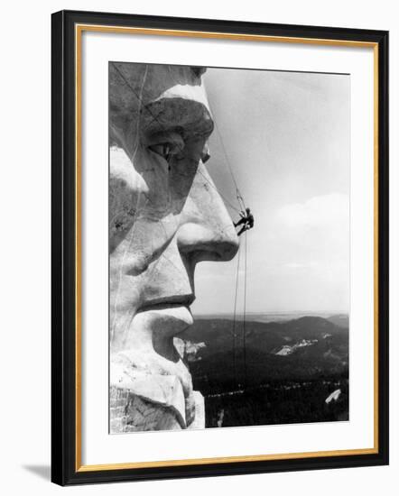 Maintenance Worker on the Nose of Mount Rushmore's Abraham Lincoln, South Dakota, 1960s-null-Framed Photo