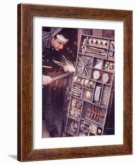 Maker of Metal Furniture, Paul Evans, Hope, PA., Burnishes Door of Steel Chest with Acetylene Torch-Nina Leen-Framed Photographic Print