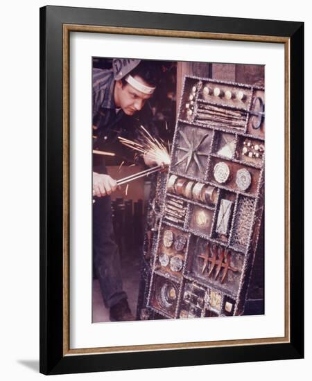 Maker of Metal Furniture, Paul Evans, Hope, PA., Burnishes Door of Steel Chest with Acetylene Torch-Nina Leen-Framed Photographic Print