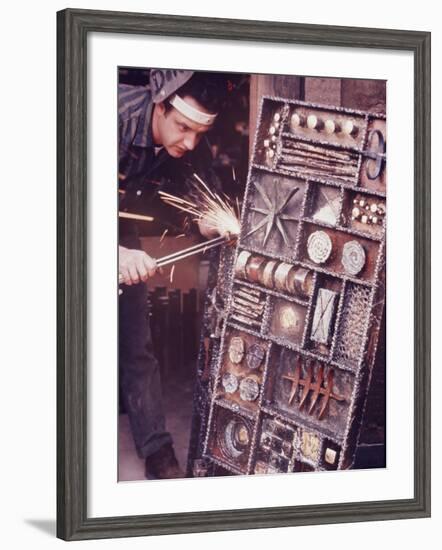 Maker of Metal Furniture, Paul Evans, Hope, PA., Burnishes Door of Steel Chest with Acetylene Torch-Nina Leen-Framed Photographic Print