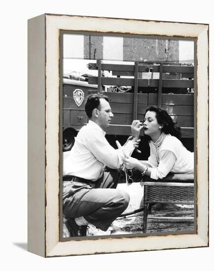 Makeup Artist Ben Nye Applying Eye Makeup to Actress Hedy Lamarr Who Observes in a Mirror-null-Framed Stretched Canvas