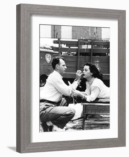 Makeup Artist Ben Nye Applying Eye Makeup to Actress Hedy Lamarr Who Observes in a Mirror-null-Framed Premium Photographic Print