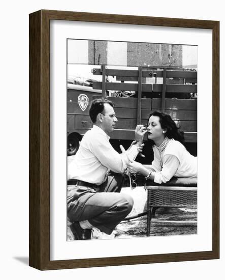 Makeup Artist Ben Nye Applying Eye Makeup to Actress Hedy Lamarr Who Observes in a Mirror-null-Framed Premium Photographic Print