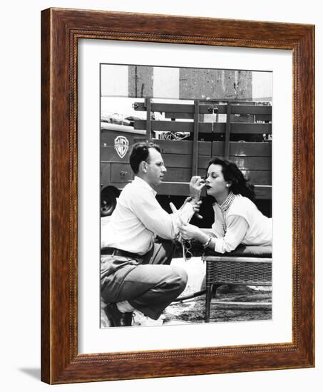 Makeup Artist Ben Nye Applying Eye Makeup to Actress Hedy Lamarr Who Observes in a Mirror-null-Framed Premium Photographic Print