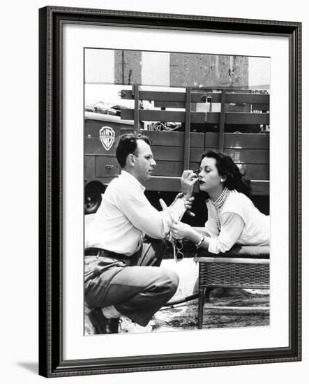 Makeup Artist Ben Nye Applying Eye Makeup to Actress Hedy Lamarr Who Observes in a Mirror-null-Framed Photo