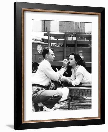 Makeup Artist Ben Nye Applying Eye Makeup to Actress Hedy Lamarr Who Observes in a Mirror-null-Framed Photo