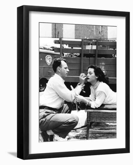 Makeup Artist Ben Nye Applying Eye Makeup to Actress Hedy Lamarr Who Observes in a Mirror-null-Framed Photo