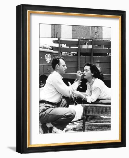 Makeup Artist Ben Nye Applying Eye Makeup to Actress Hedy Lamarr Who Observes in a Mirror-null-Framed Photo