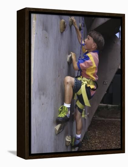 Male Child Wall Climbing Indoors-null-Framed Premier Image Canvas