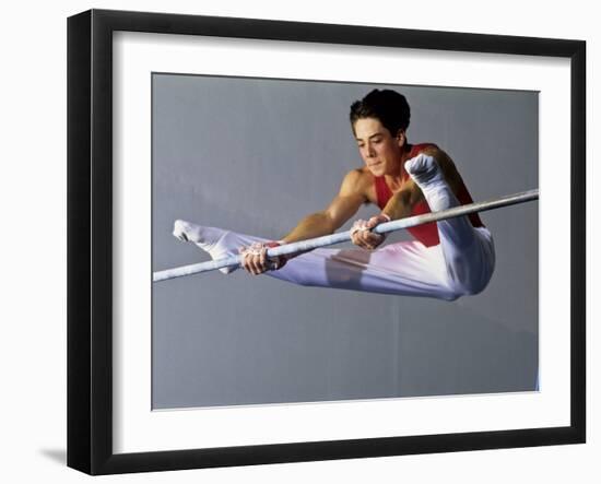 Male Gymnast Performing on the Horizontal Bar-null-Framed Photographic Print