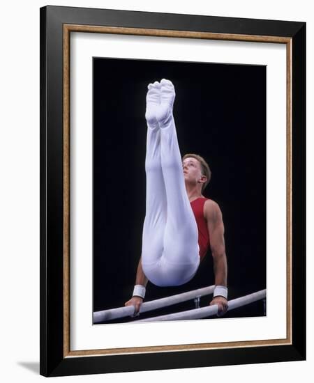 Male Gymnast Performing on the Parallel Bars-null-Framed Photographic Print