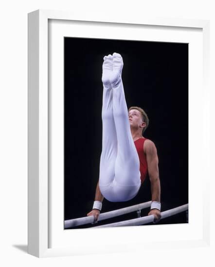 Male Gymnast Performing on the Parallel Bars-null-Framed Photographic Print