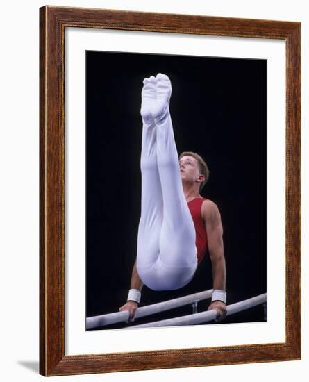 Male Gymnast Performing on the Parallel Bars-null-Framed Photographic Print