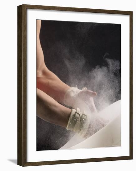 Male Gymnast Putting Chalk on his Hands, Bainbridge Island, Washington State, USA-null-Framed Photographic Print