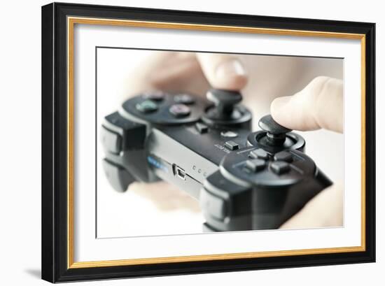 Male Hands Holding Video Game Controller Closeup-elenathewise-Framed Photographic Print