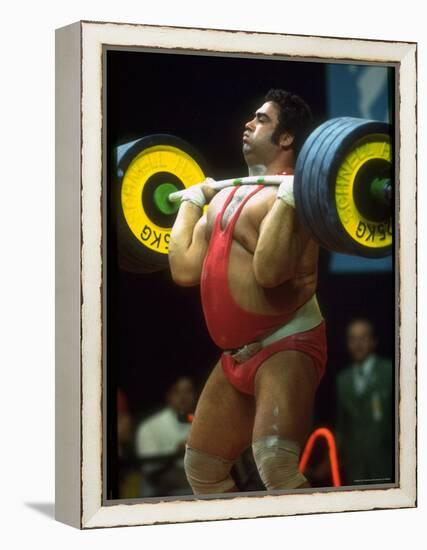 Male Lifting Heavy Weights in Competition at the Olympics-John Dominis-Framed Premier Image Canvas