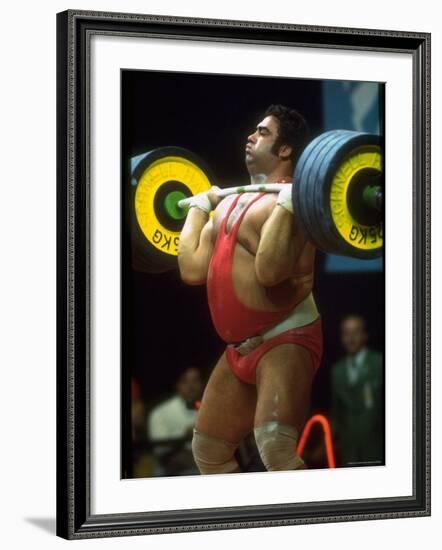 Male Lifting Heavy Weights in Competition at the Olympics-John Dominis-Framed Premium Photographic Print