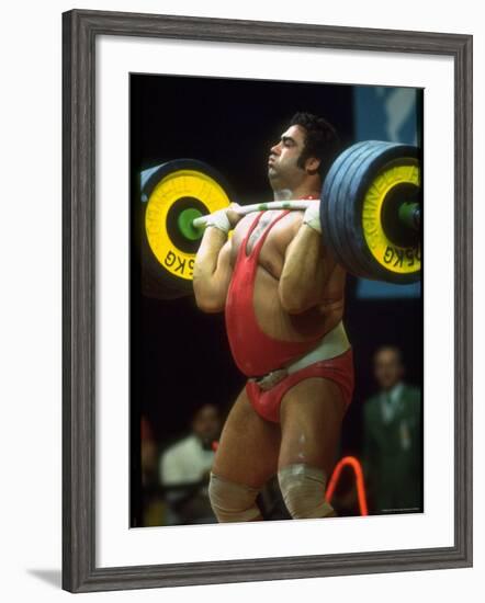 Male Lifting Heavy Weights in Competition at the Olympics-John Dominis-Framed Premium Photographic Print