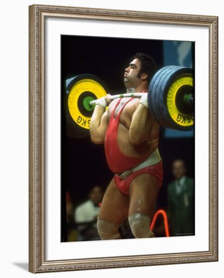 Male Lifting Heavy Weights in Competition at the Olympics-John Dominis-Framed Premium Photographic Print